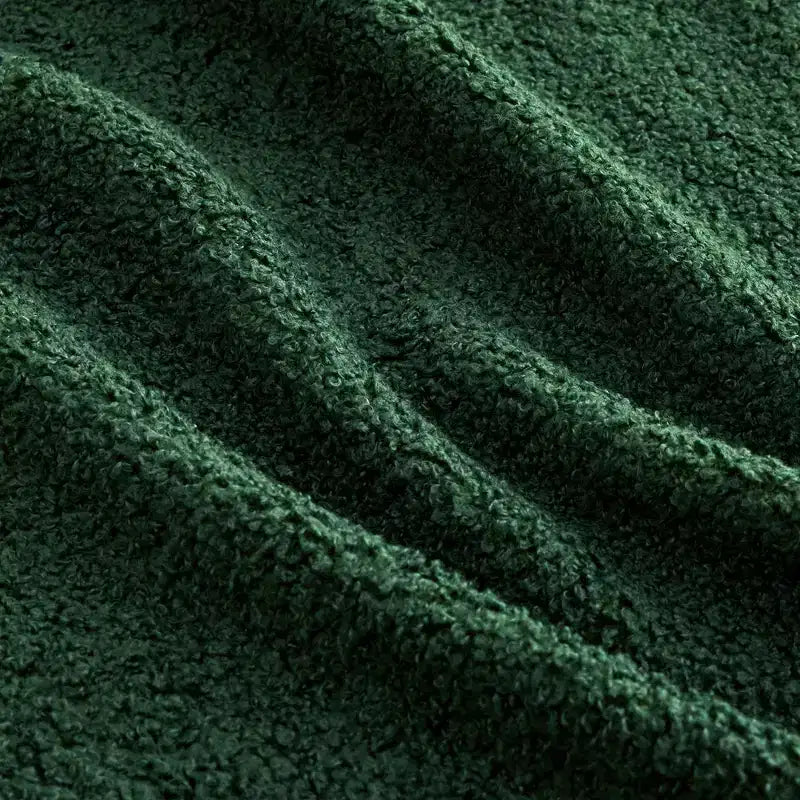 Divano componibile a L in tessuto teddy nero / cammello / verde / bianco – 3 posti