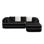 Divano componibile a L in tessuto teddy nero / cammello / verde / bianco – 3 posti