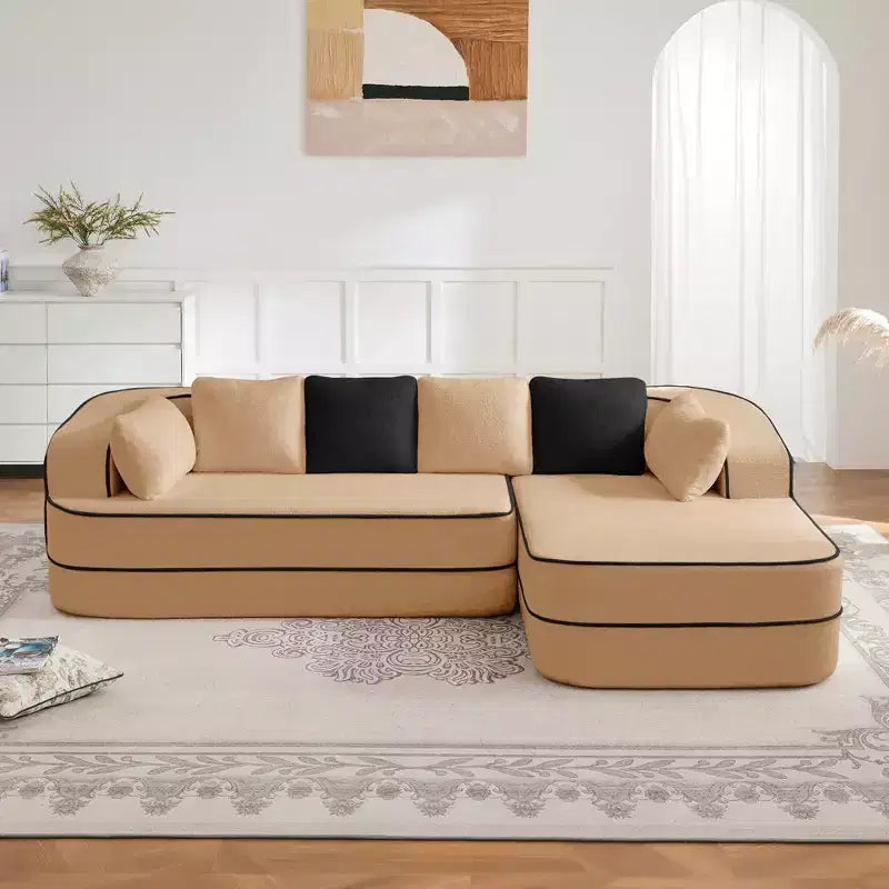 Divano componibile a L in tessuto teddy nero / cammello / verde / bianco – 3 posti