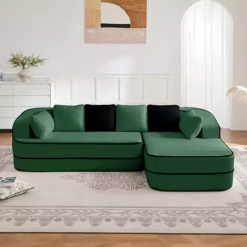 Divano componibile a L in tessuto teddy nero / cammello / verde / bianco – 3 posti